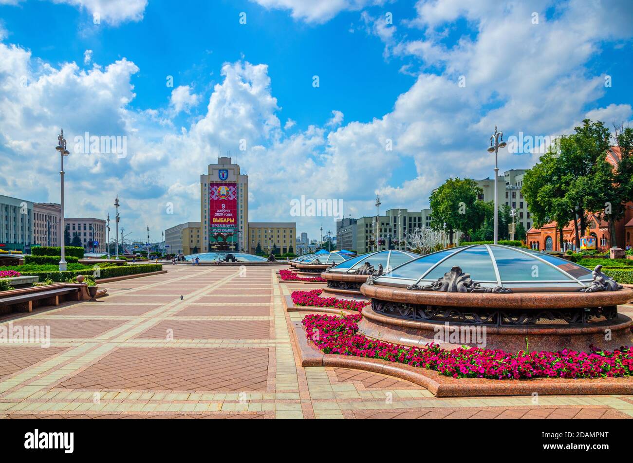 Minsk, Belarus, July 26, 2020: Maxim Tank Belarusian State Pedagogical University with Presidential elections huge advertising announcement poster and Government House building on Independence Square Stock Photo
