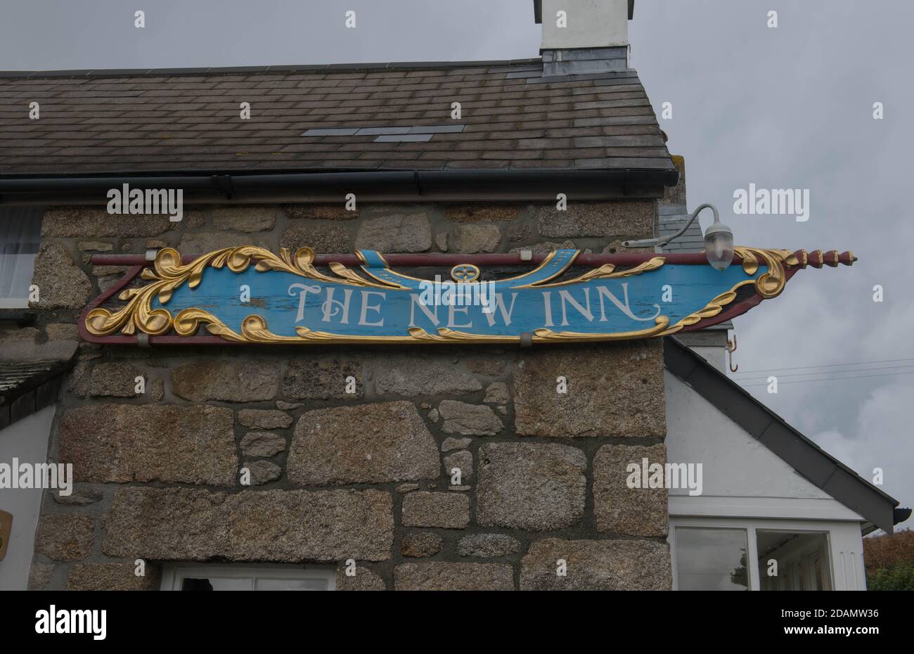 The New Inn Hotel and Pub Sign in the Harbour of New Grimsby on the Island of Tresco in the Isles of Scilly, England, UK Stock Photo