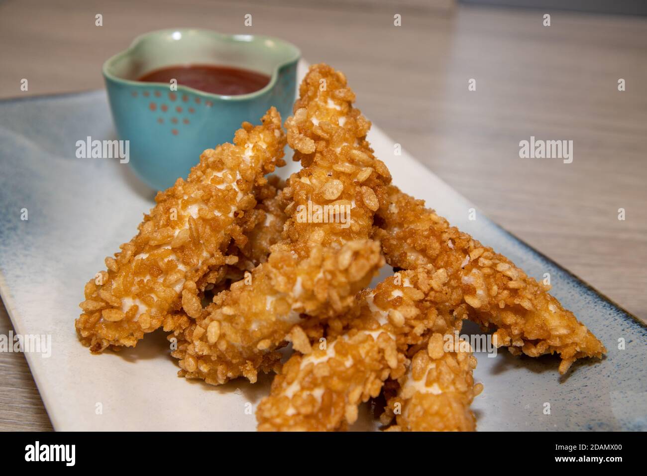 A plate of crispy chicken strips made from Rice Krispies Multigrain