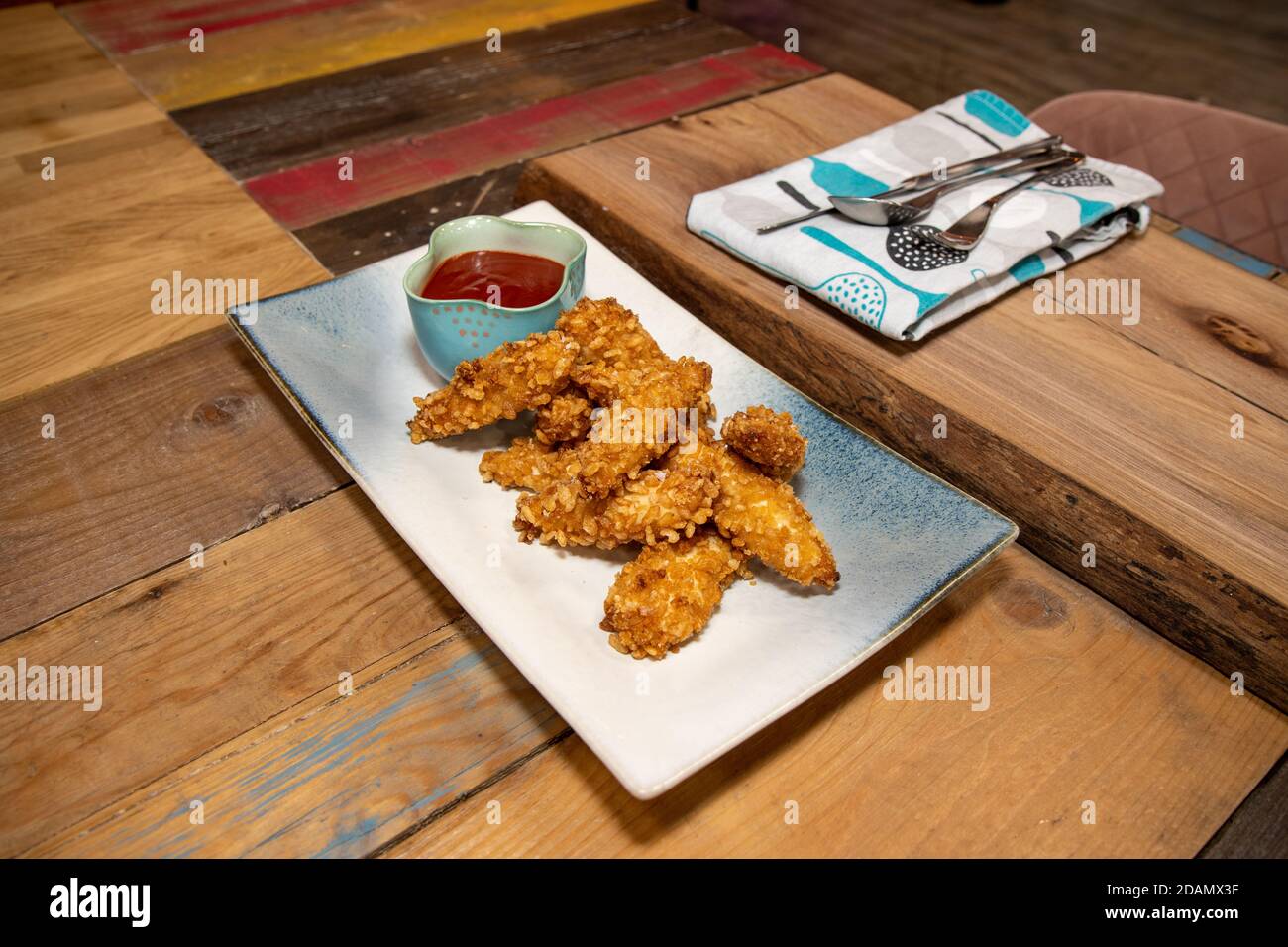 A plate of crispy chicken strips made from Rice Krispies Multigrain