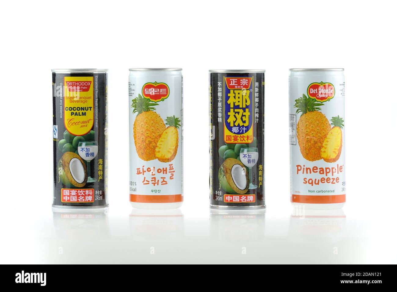 Coconut and pineapple juices. Popular Chinese soft beverages. Chinese and Englich side visible. Studio shot on bright background. Stock Photo