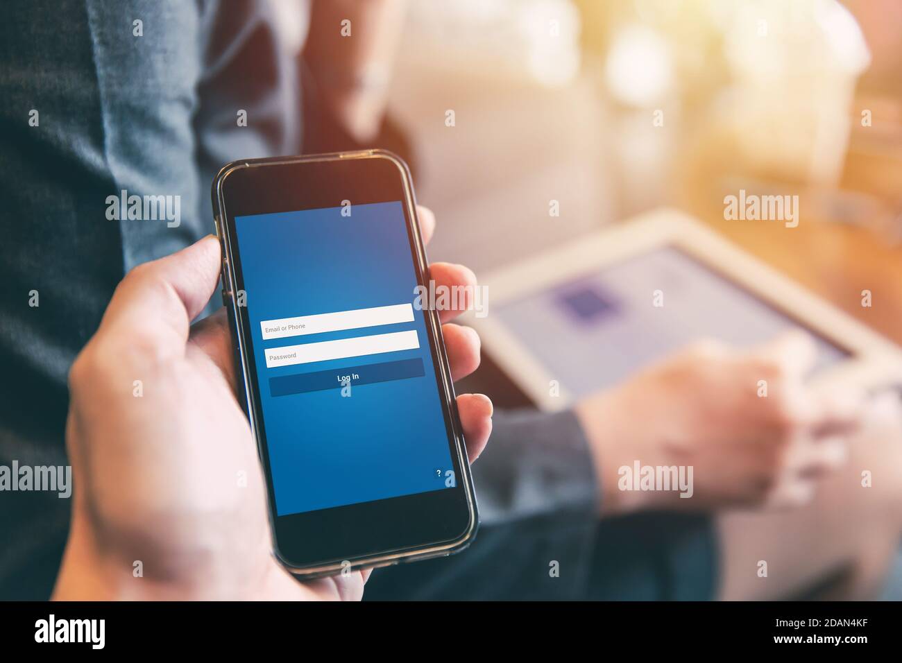 closeup hand holding smatphone with application software security login screen. Stock Photo