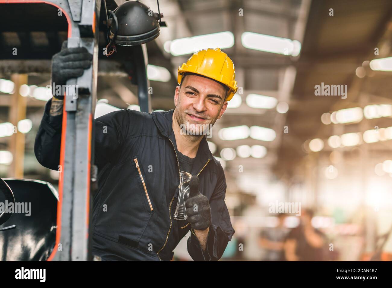 Portrait of caucasian worker happy smiling hand thumbs up for good working at cargo logistic shipping industry factory or warehouse workplace. Stock Photo