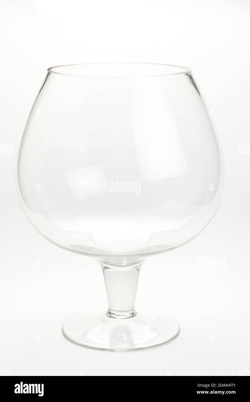 Vertical shot of a brandy glass on a white background Stock Photo