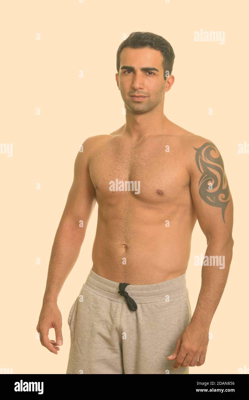 Young handsome Iranian man shirtless Stock Photo - Alamy