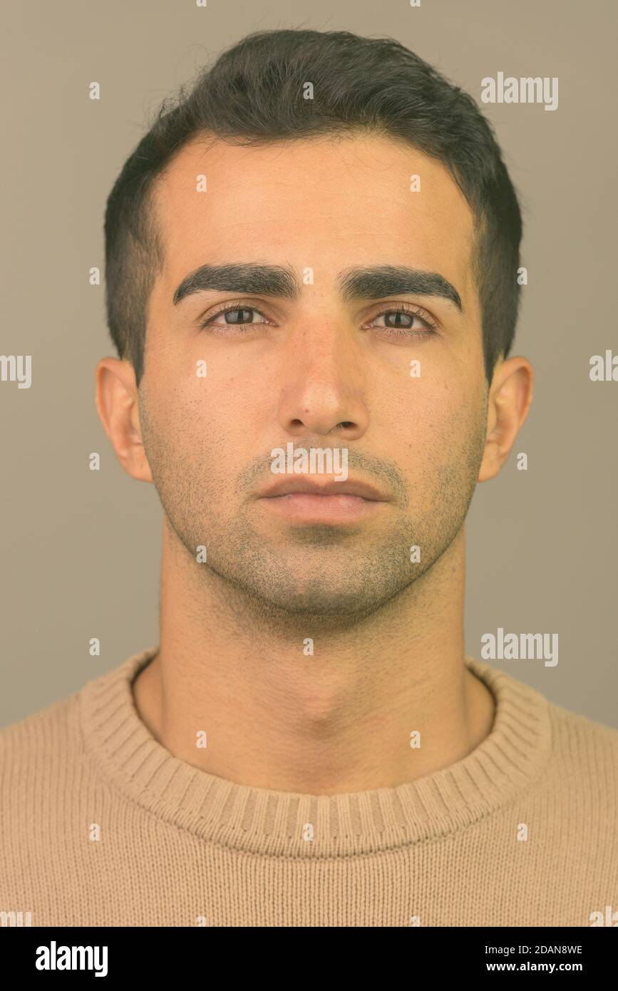 Face of young handsome Iranian man Stock Photo - Alamy