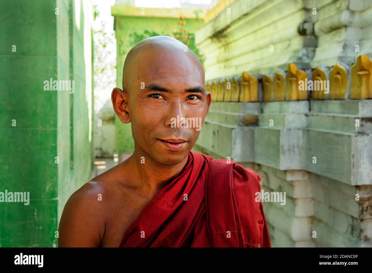 Portrait of a happy young Buddhist monk in a Sagaing temple near Mandalay Myanmar Stock Photo