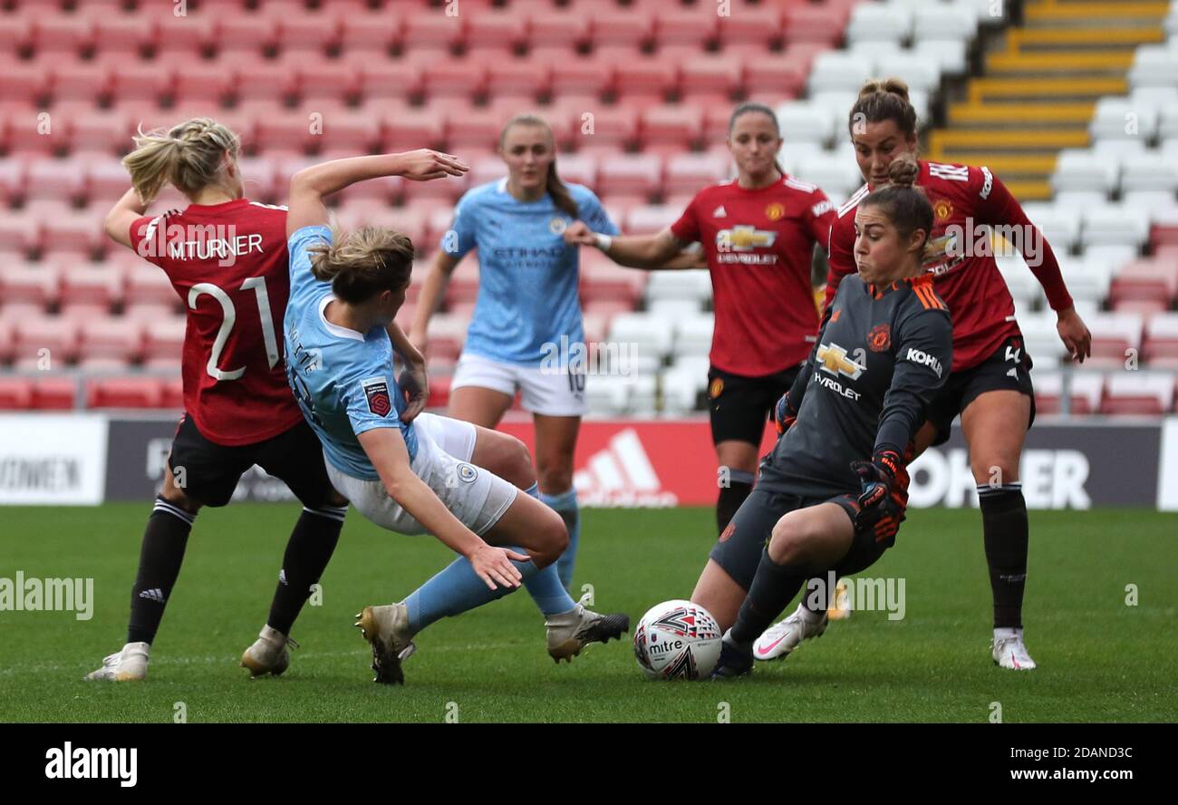 Manchester City's Ellen White (centre) under pressure from Manchester United's Mary Earps (right) and Millie Turner during the FA Women's Super League match at Leigh Sports Village. Stock Photo