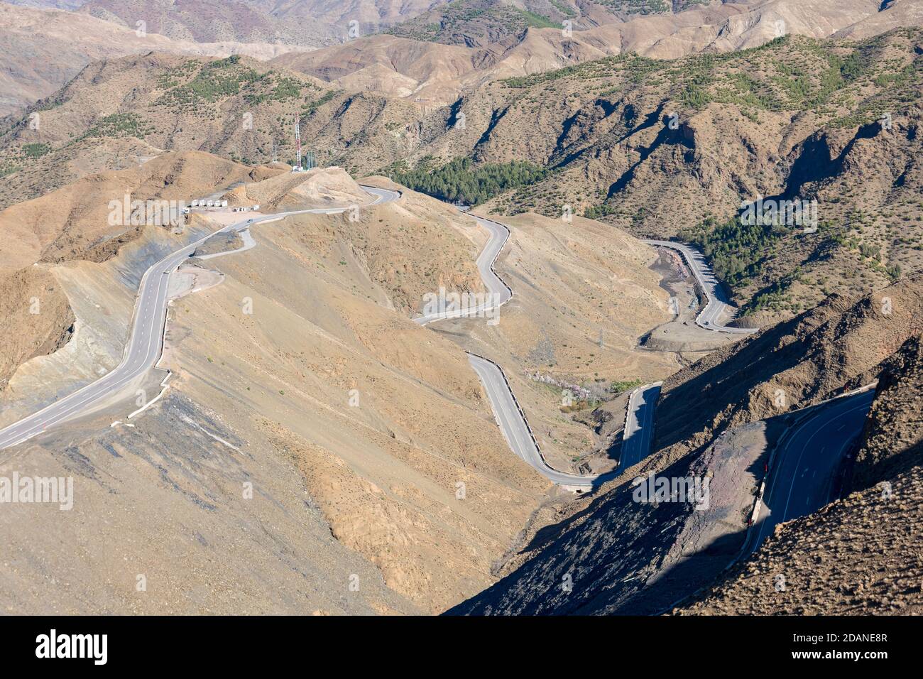 Curved road in Tizi n Tichka mountain pass in the Atlas Mountains. Road to the Sahara desert. Travel concept. High Atlas, Morocco Stock Photo
