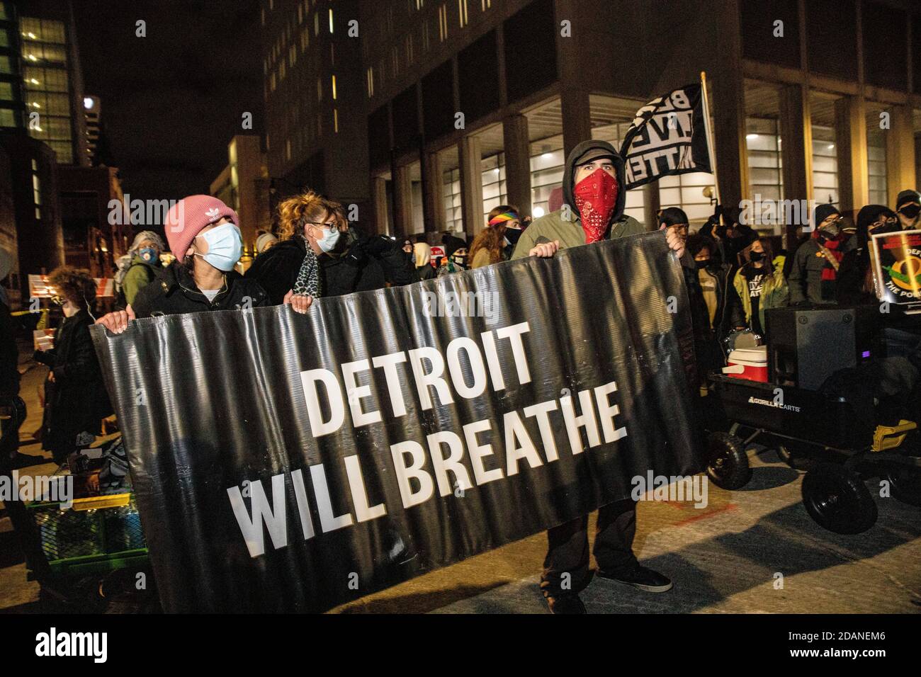 Protesters hold 'Detroit Will Breathe' banner during the march.Detroit Will Breathe, an activist group against police brutality and for Black Lives, organized a 'Chief Craig Resign' night march in downtown Detroit. This particular protest focused on Police Chief James Craig's treatment of right wing protesters who entered Detroit to stop the counting of votes in the TCF Center on the day after the election. Detroit Will Breathe claims their peaceful protesters have been sent to the hospital by the Detroit Police, while the right wing protesters were welcomed into Detroit. Kevin Saunderson, one Stock Photo
