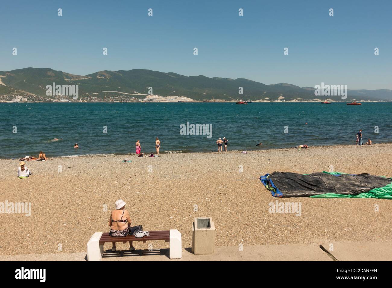 Russia, Novorossiysk, July 11, 2020: Central beach of the black sea city. Citizens and guests relax on a Sunny summer day Stock Photo