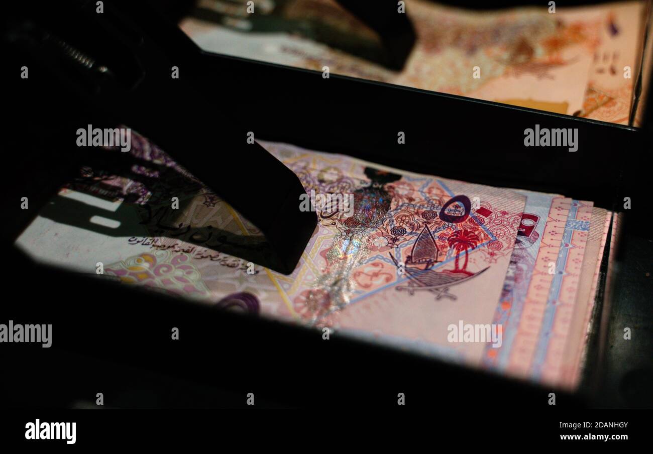 Qatar currency notes in a shop cash counter Stock Photo Alamy
