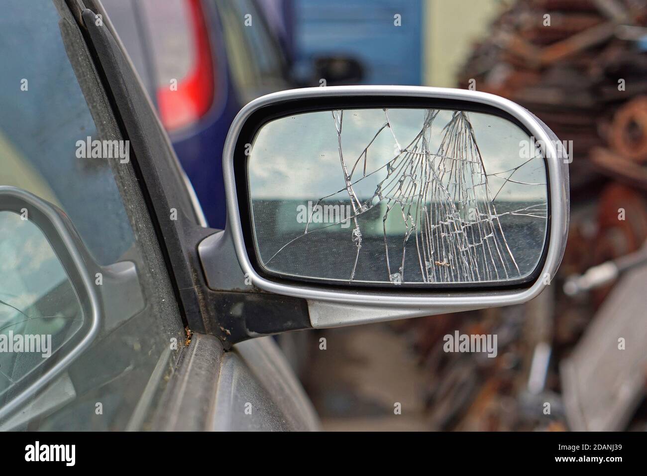 Cracked glass at car side mirror damaged Stock Photo Alamy