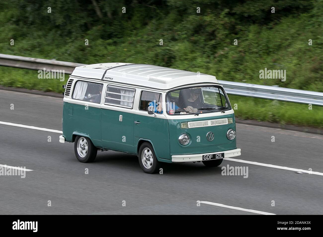 Volkswagen camper Motor Caravan Green LCV driving on the M6 motorway near Preston in Lancashire, UK. Stock Photo