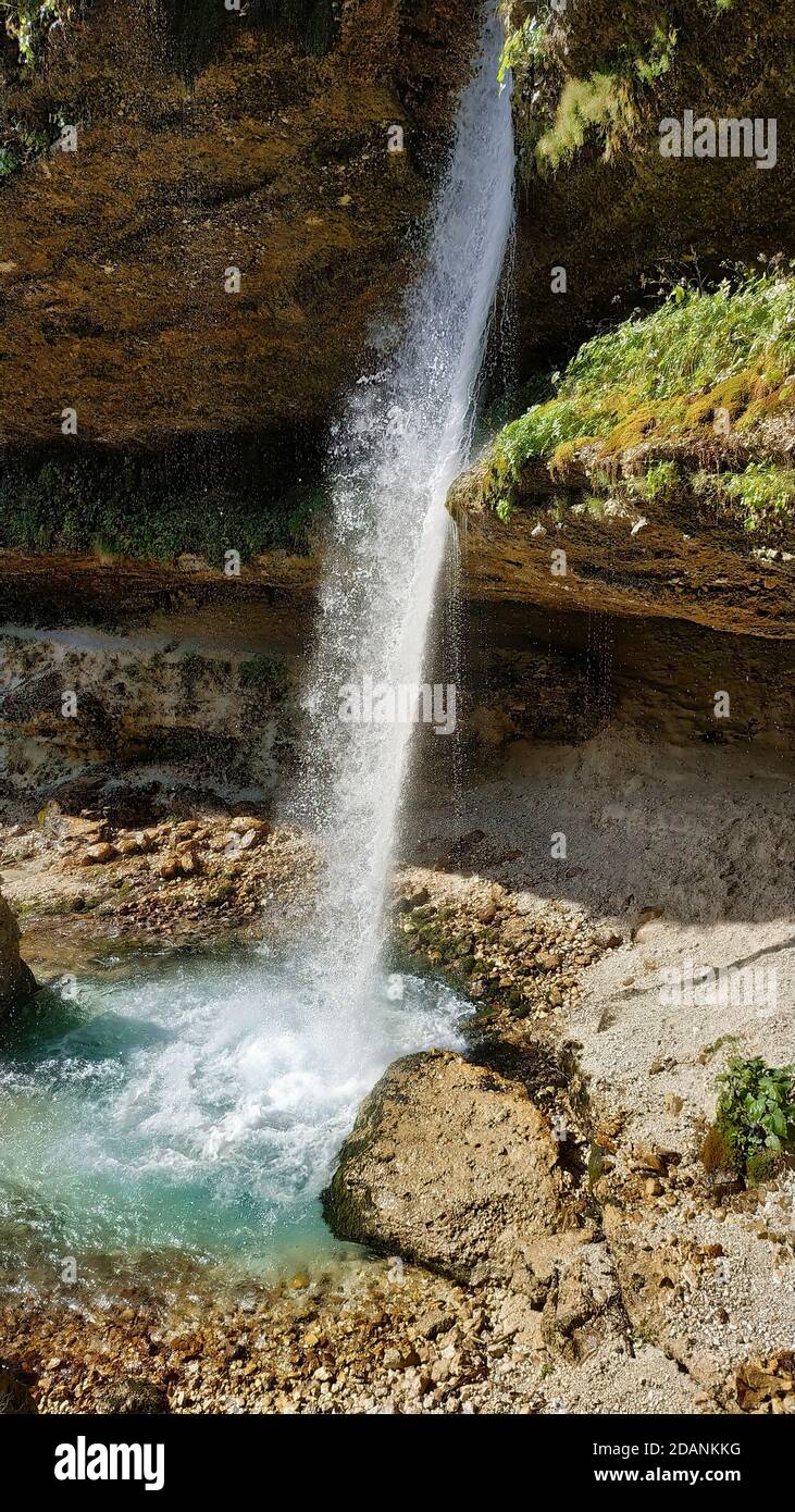 Vertical shot of a waterfall in a park Stock Photo - Alamy