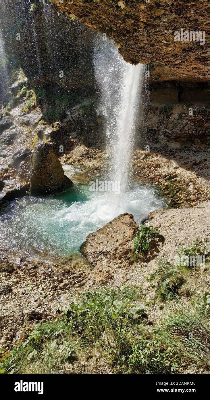 Vertical shot of a waterfall in a park Stock Photo - Alamy