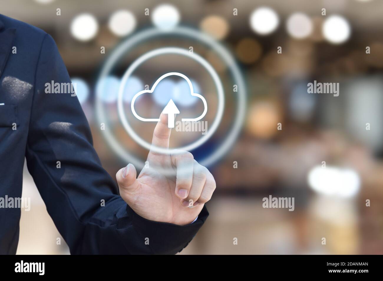 Businessman hand pressing cloud upload icon on virtual touchscreen interface. copy space. Stock Photo