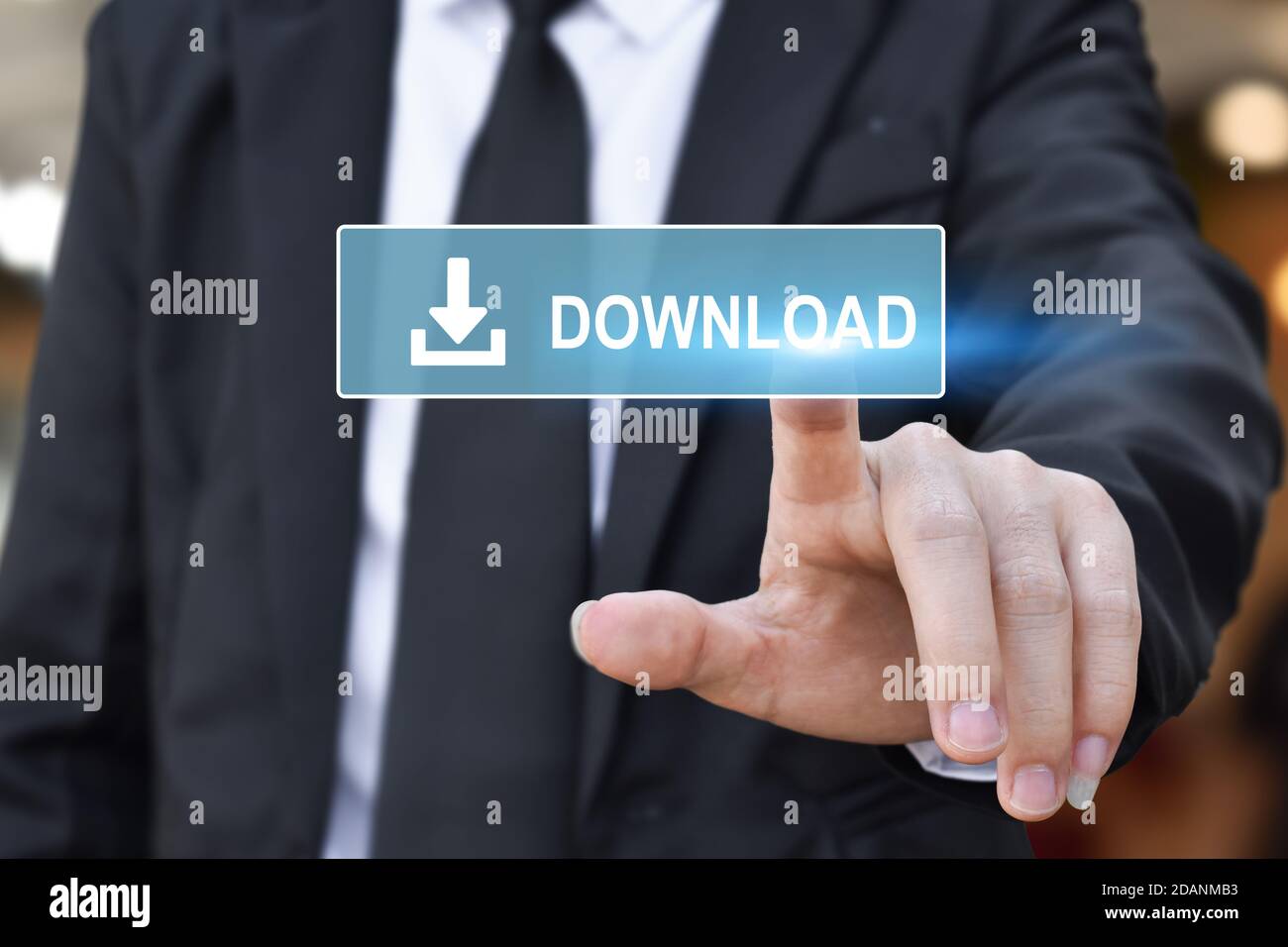 Businessman hand pushing web download icon on virtual touchscreen interface. Stock Photo