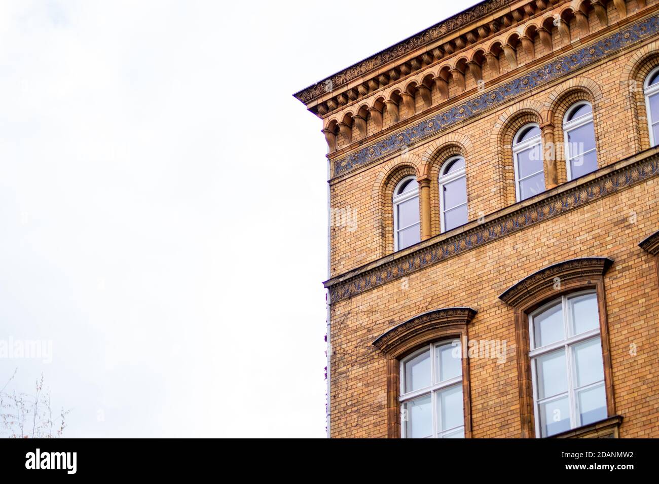 old brick building and white cloudy sky Stock Photo - Alamy