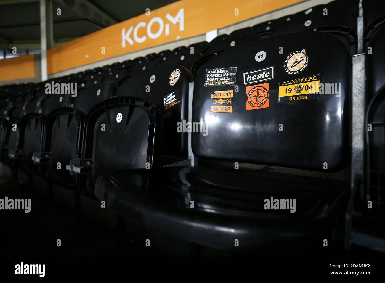 A view of stickers on empty seats in the stands before the Sky Bet League One match at the KCOM Stadium, Kingston upon Hull. Stock Photo