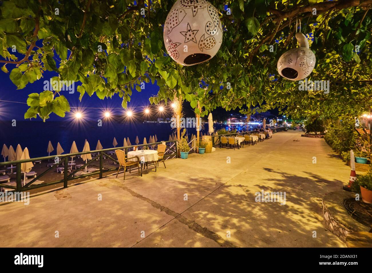 Main street and cafes near the sea in Turunc, Turkey Stock Photo