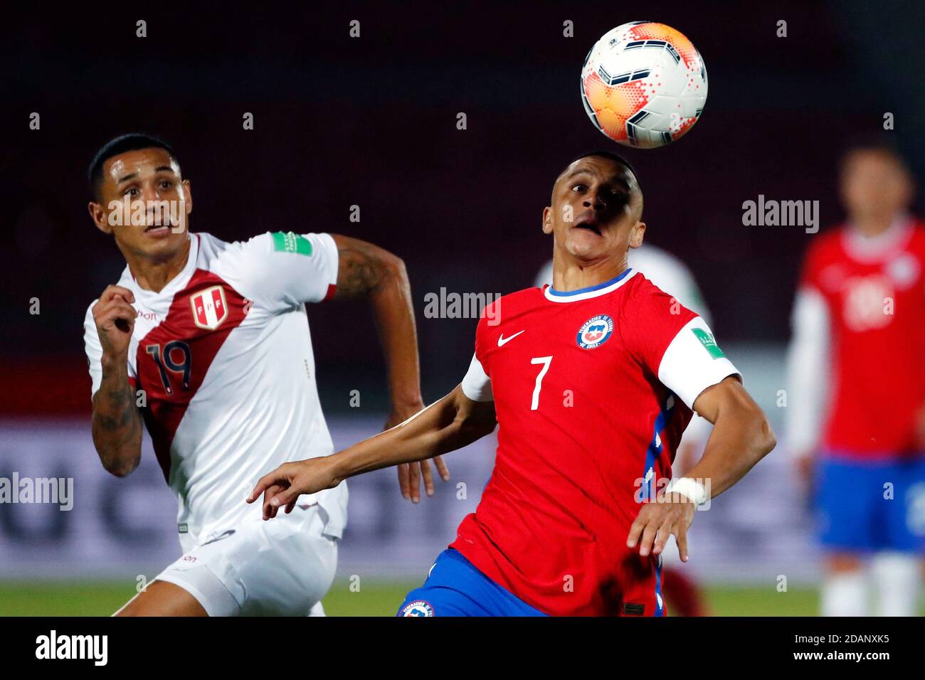 13th November 2020; National Stadium of Santiago, Santiago, Chile; World Cup 2020 Football qualification, Chile versus Peru;  Alexis Sanchez of Chile turns away from Yoshimar Yotun of Peru Stock Photo