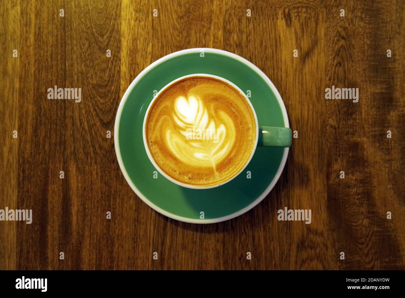 Strong coffee on the wooden table background. Fresh coffee. Coffee in cup. Cappuccino coffee. Espresso coffee. Latte coffee. Coffee on table. Stock Photo