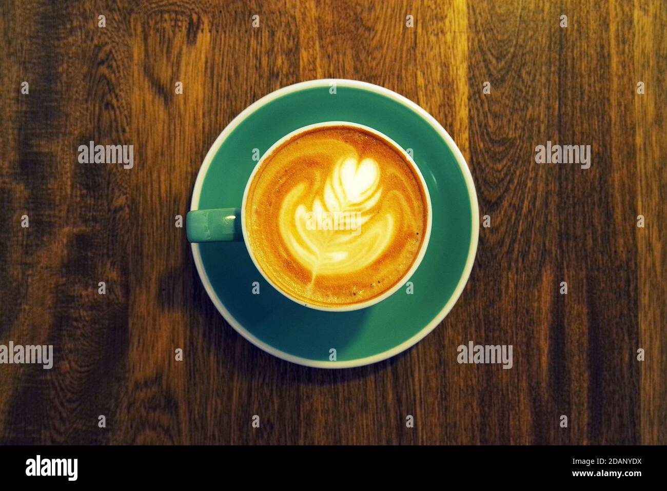 Strong coffee on the wooden table background. Fresh coffee. Coffee in cup. Cappuccino coffee. Espresso coffee. Latte coffee. Coffee on table. Stock Photo