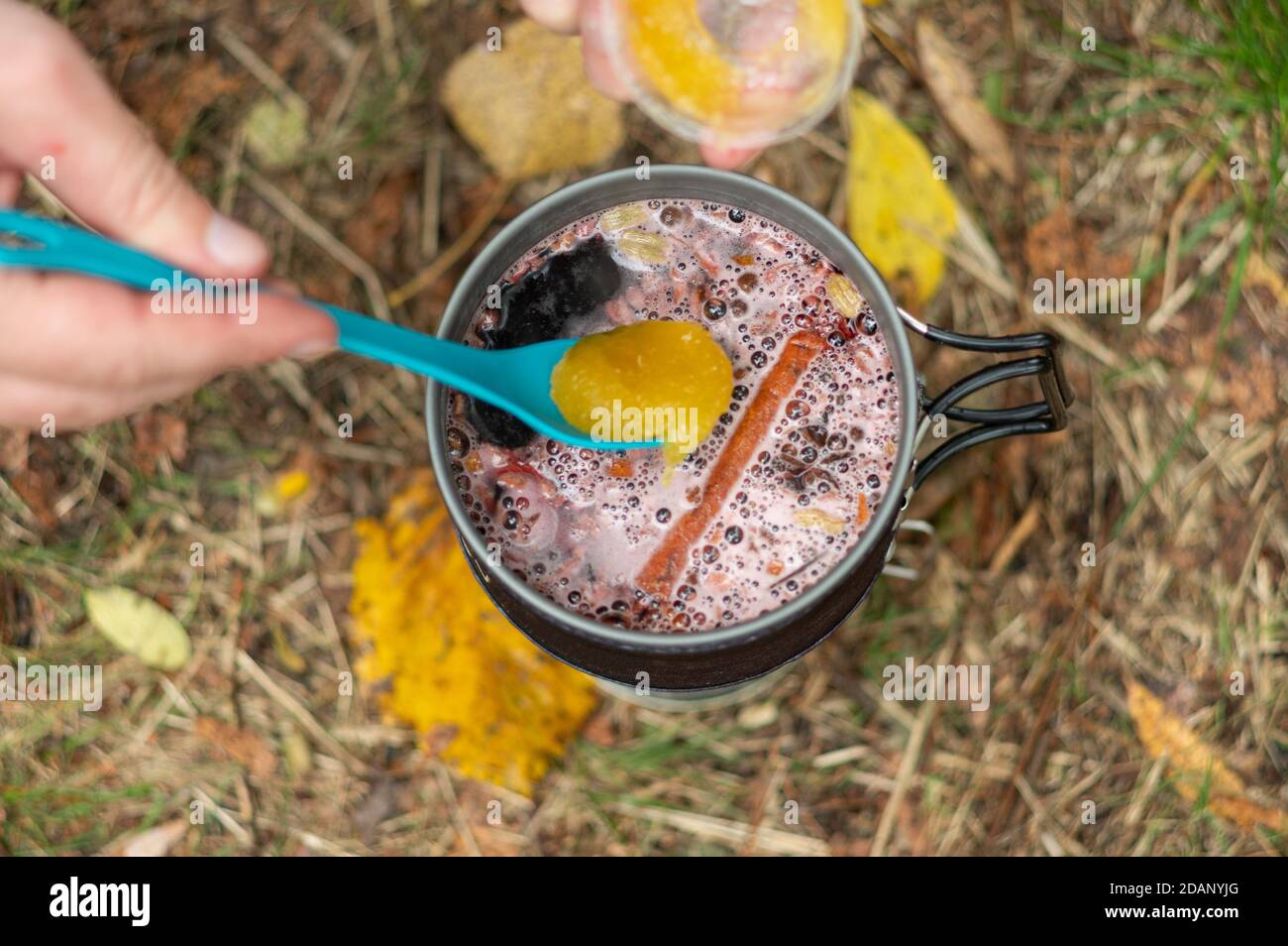 Adding honey to mulled wine. Cooking mulled wine with honey Stock Photo Alamy