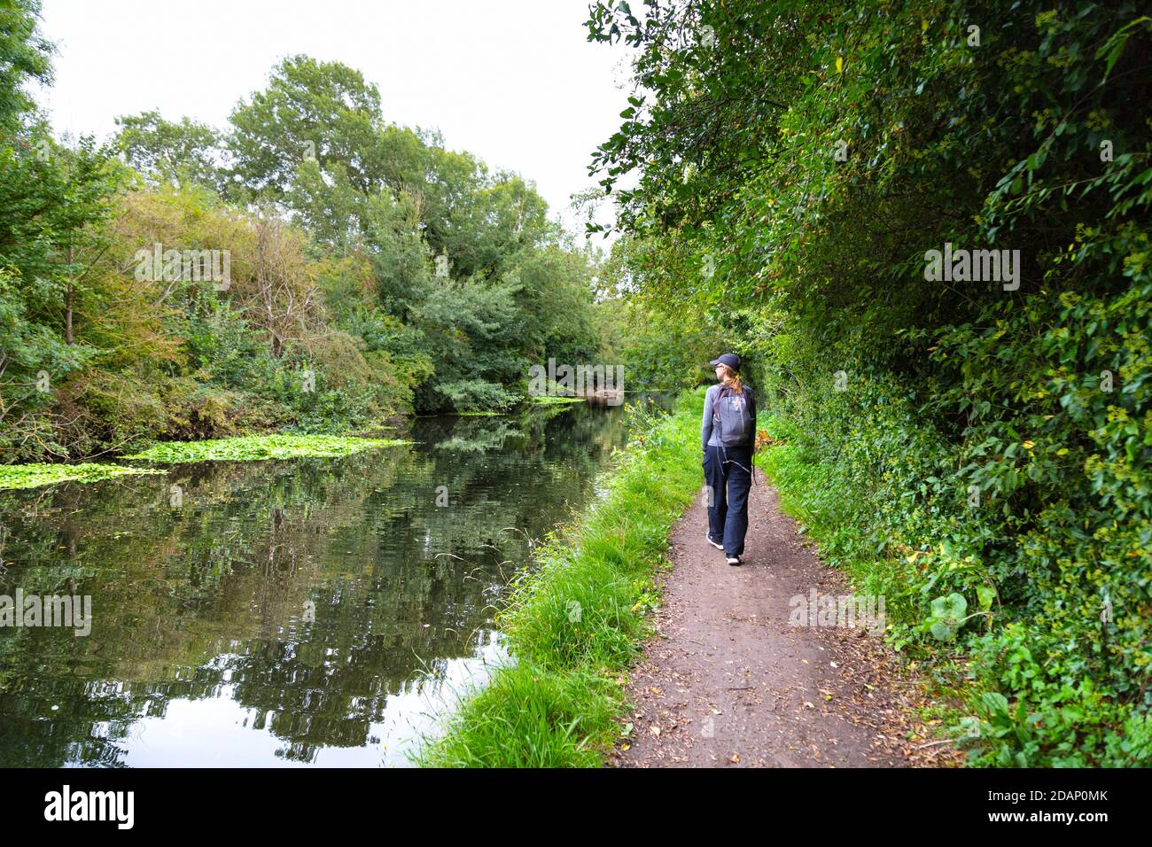 Hiker walking along the Grand Union Canal in Colne Valley, Uxbridge, UK Stock Photo