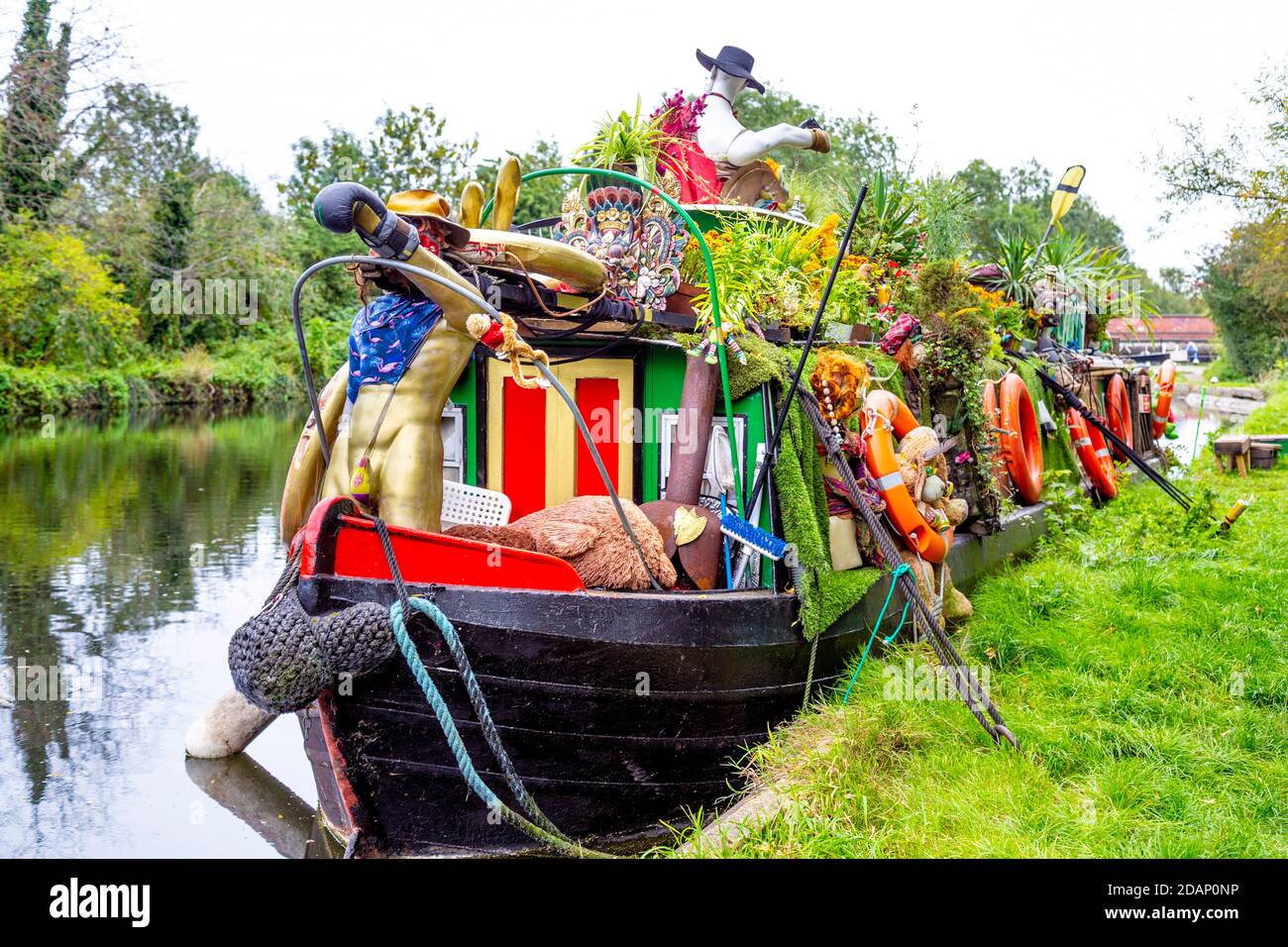 An unusual, decorated barge houseboat along the Grand Union Canal in Colne Valley, Uxbridge, UK Stock Photo