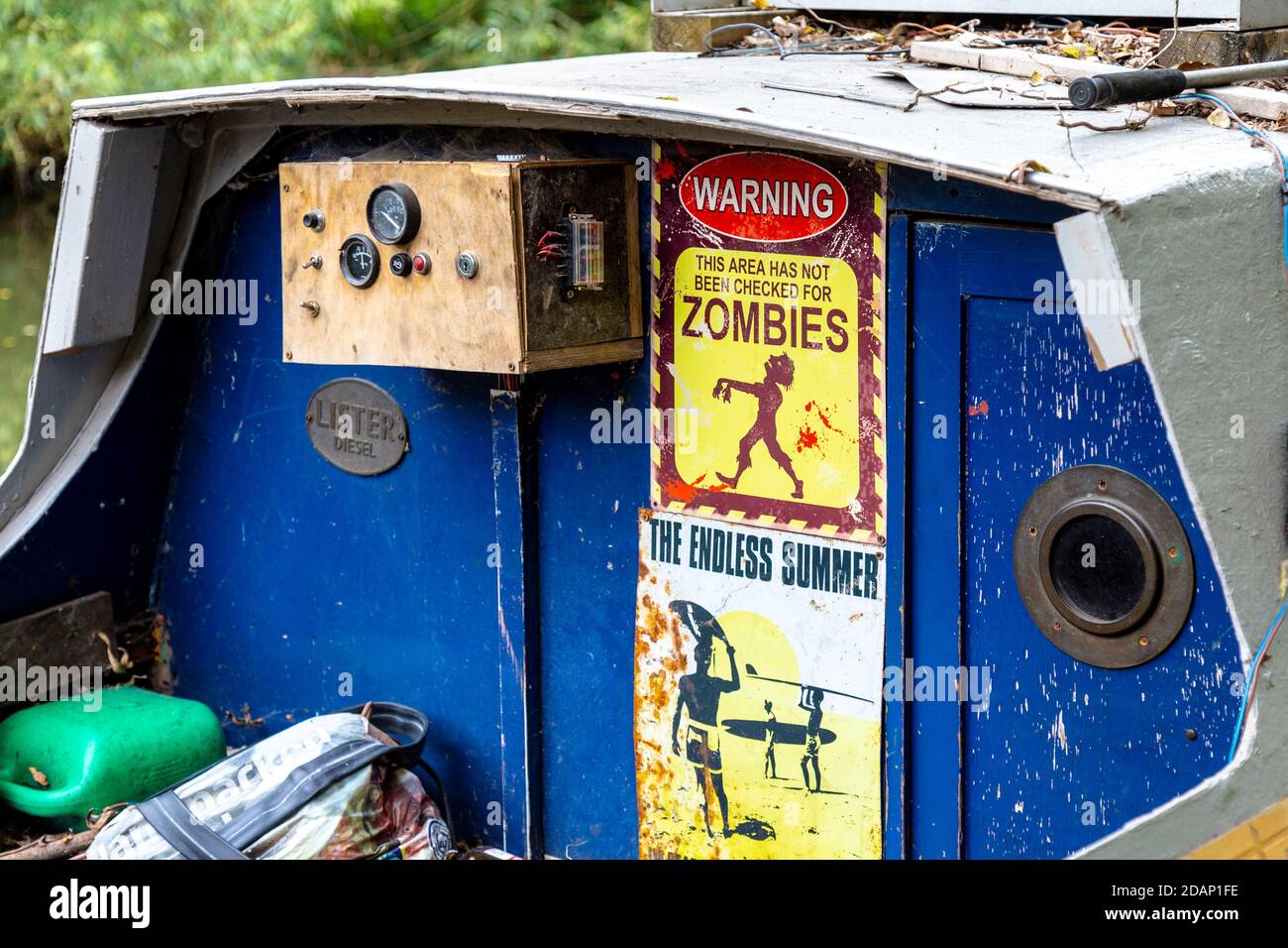 Barge decorated with unusual signs along the Grand Union Canal, Colne Valley, UK Stock Photo