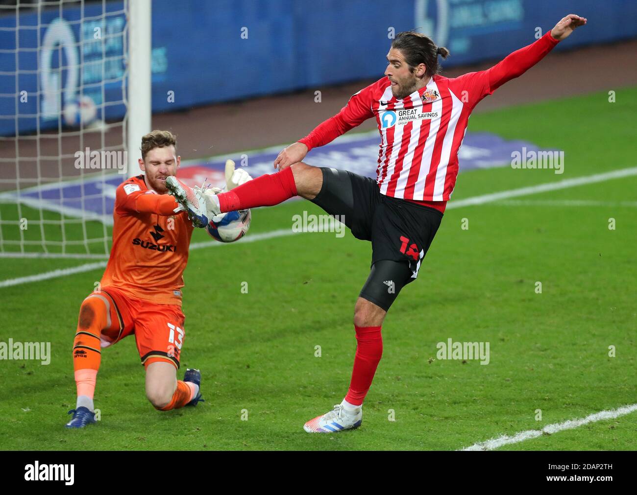 Milton Keynes Dons goalkeeper Andrew Fisher (left) and Sunderland's Danny Graham battle for the ball during the Sky Bet League One match at the Stadium of Light, Sunderland. Stock Photo