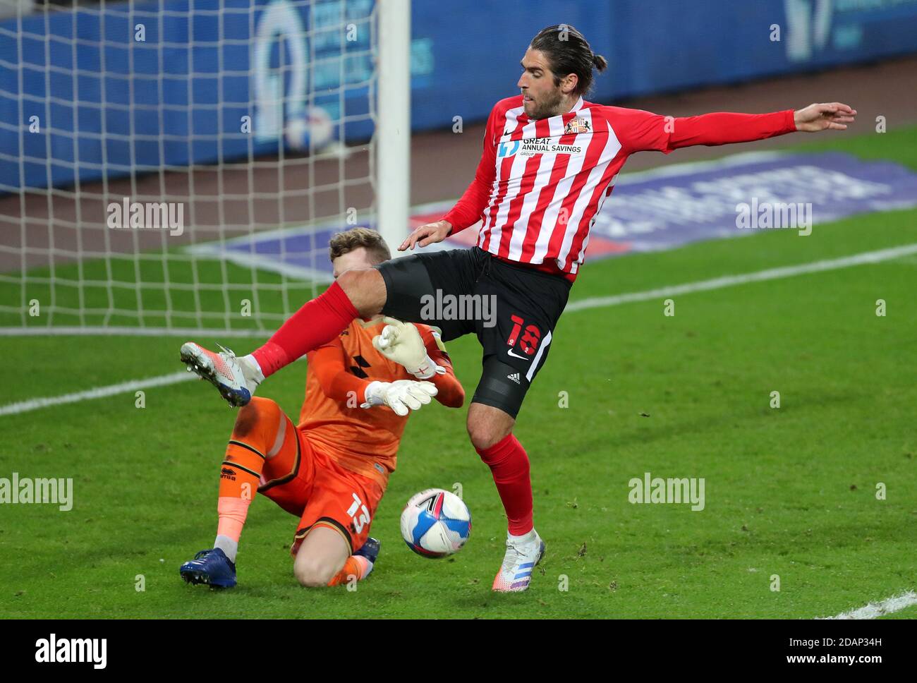 Milton Keynes Dons goalkeeper Andrew Fisher (left) and Sunderland's Danny Graham battle for the ball during the Sky Bet League One match at the Stadium of Light, Sunderland. Stock Photo