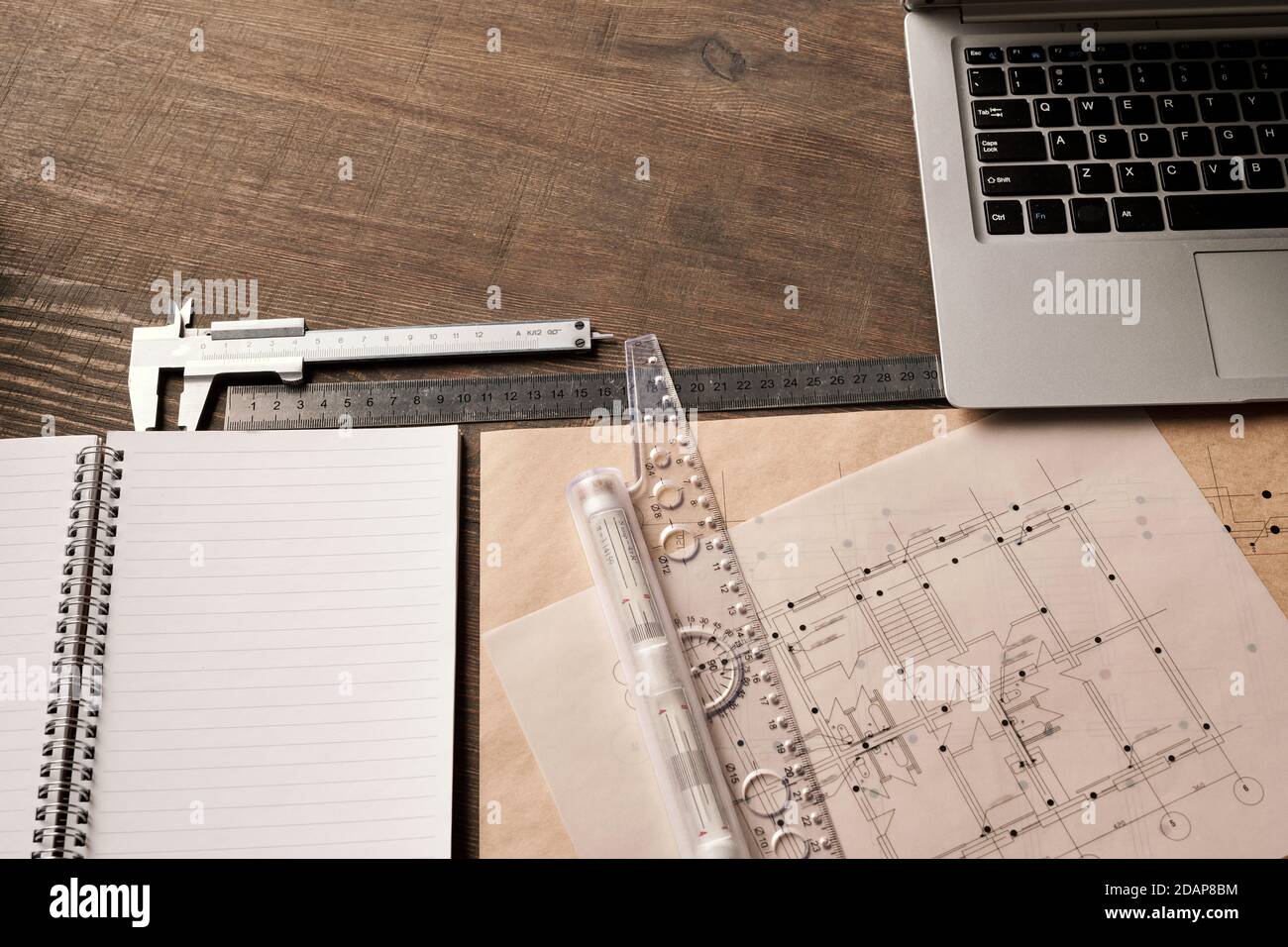 Laptop Ng Ruler Laptop keypad, rulers and handtool, open copybook surrounded by ...