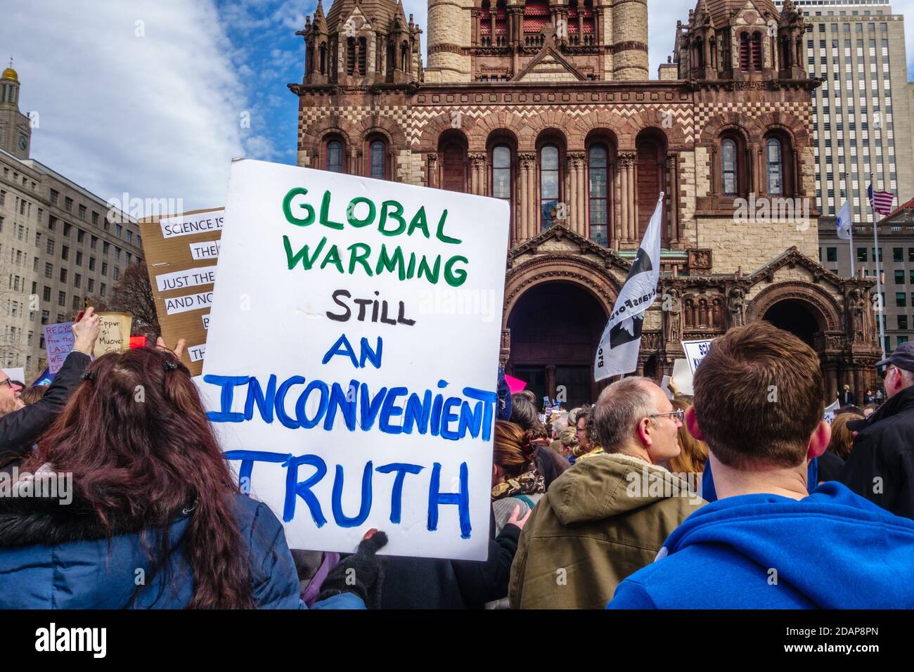 Protesters hold signs at Climate Change Demonstration in Boston, Massachusetts, USA. Stock Photo