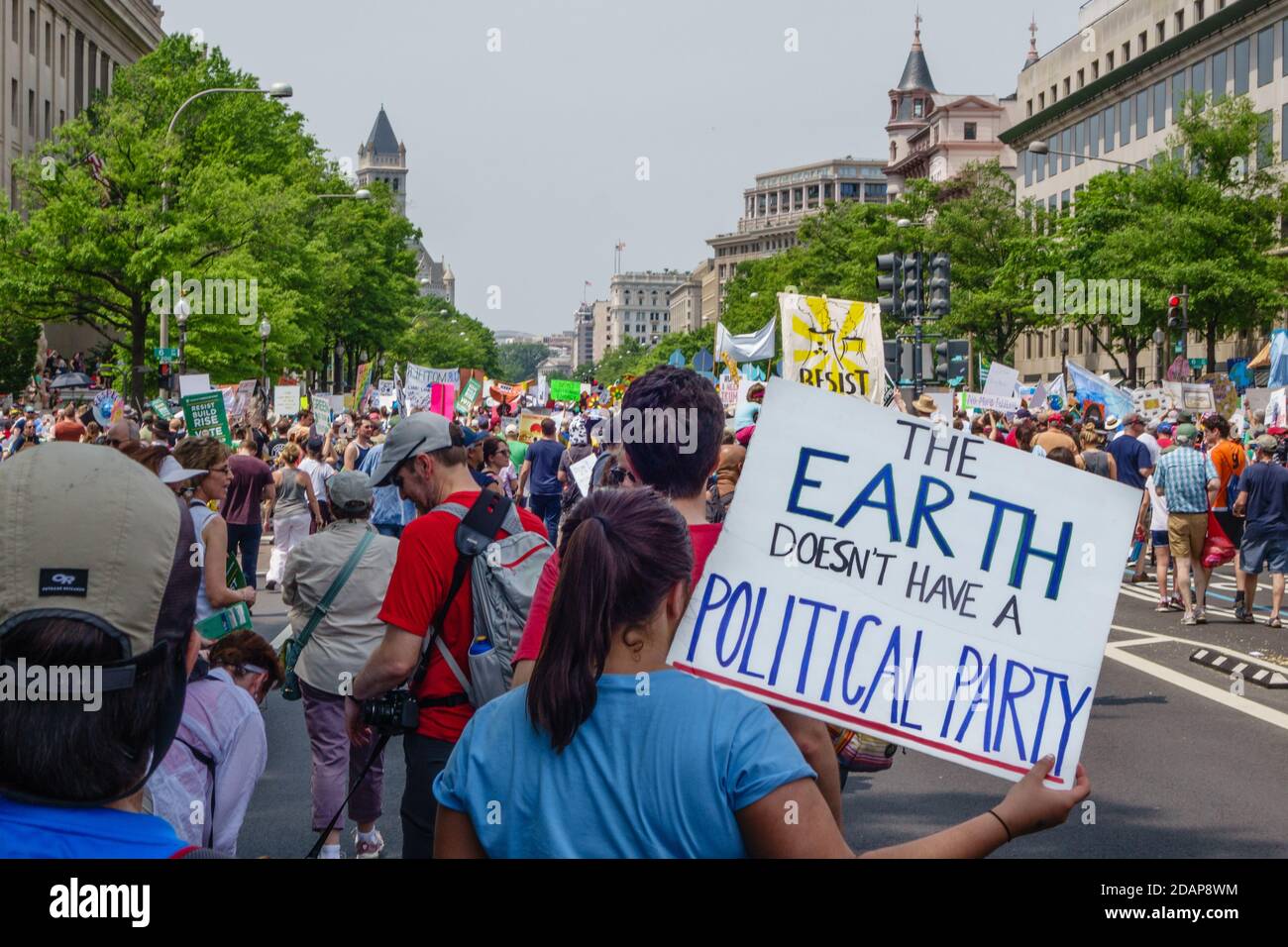 Protesters hold signs at climate change demonstration in Washington, DC, USA. Stock Photo