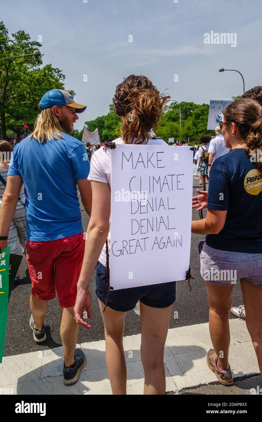 Protesters hold signs at climate change demonstration in Washington, DC, USA. Stock Photo