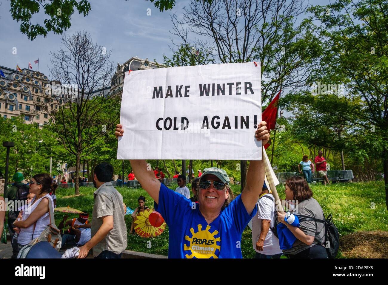 Protesters hold signs at climate change demonstration in Washington, DC, USA. Stock Photo