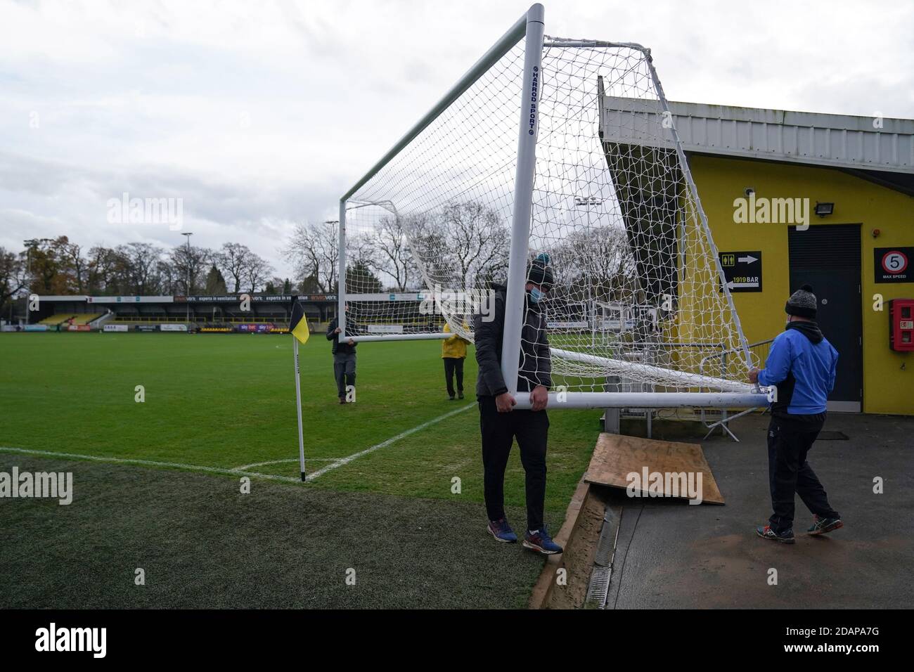 A general view of the groundsmen moving a net before the Sky Bet League Two match at the EnviroVent Stadium, Harrogate. Stock Photo