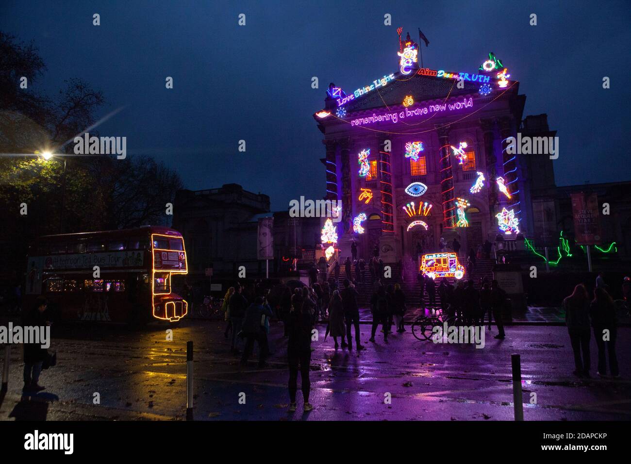 London, UK, 14 November 2020: despite some rain, Londoners flocked to see artist Chila Kumari Singh Burman's winter lights commission at Tate Britain, 'Remembering A Brave New World'. Some were marking the start of Diwali but others were just looking for any form of outdoor entertainment allowed under lockdown restrictions. Anna Watson/Alamy Live News Stock Photo
