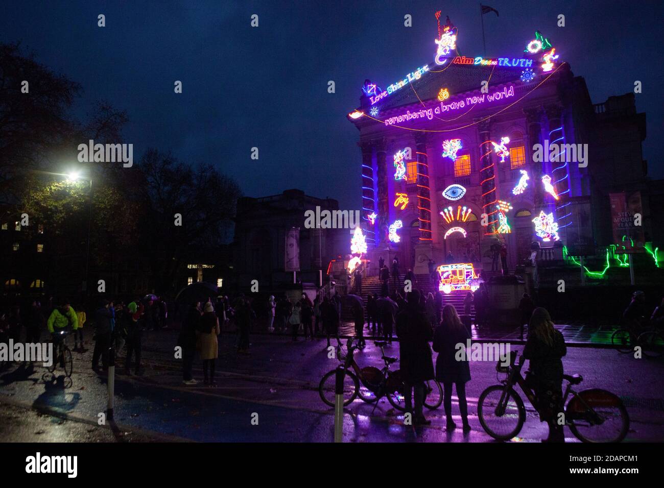 London, UK, 14 November 2020: despite some rain, Londoners flocked to see artist Chila Kumari Singh Burman's winter lights commission at Tate Britain, 'Remembering A Brave New World'. Some were marking the start of Diwali but others were just looking for any form of outdoor entertainment allowed under lockdown restrictions. Anna Watson/Alamy Live News Stock Photo