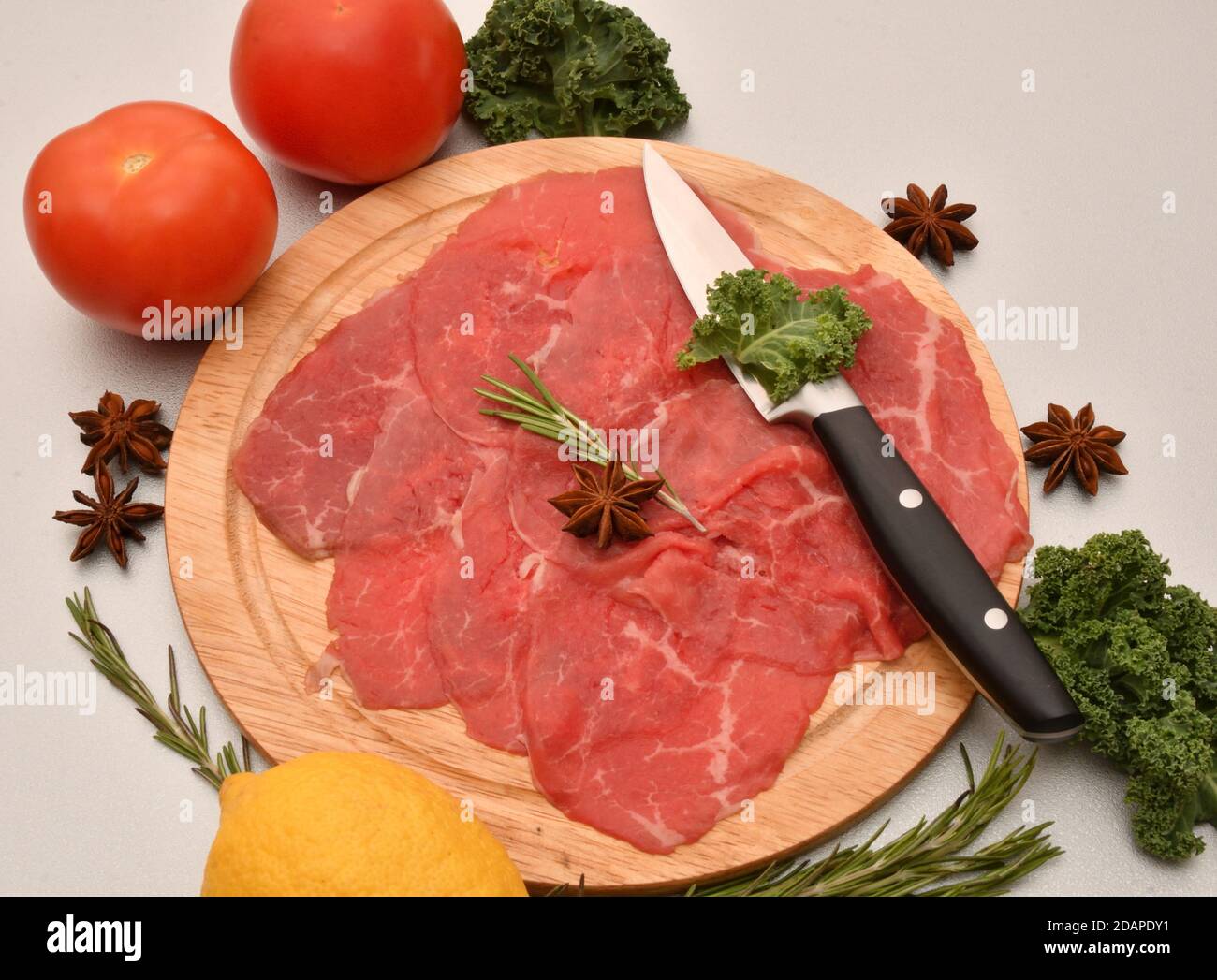 Carpaccio dish of thinly sliced pieces (slices) raw beef tenderloin Stock Photo