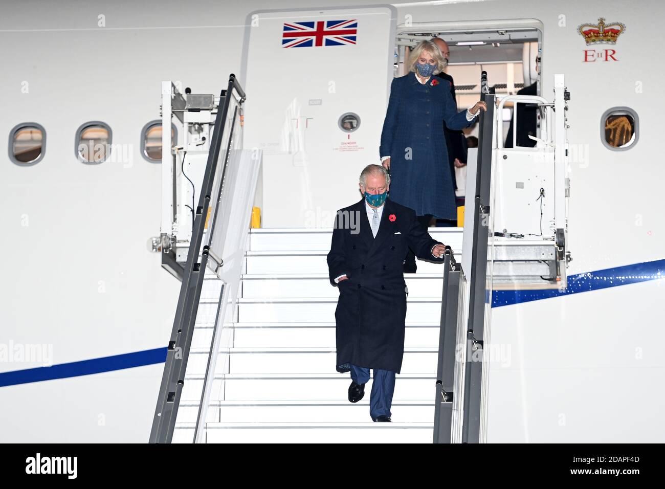 The Prince of Wales and The Duchess of Cornwall disembark from RAF Voyager as they arrive at Berlin Brandenburg Airport, Germany, ahead of a their visit to commemorate the National Day of Mourning. Stock Photo