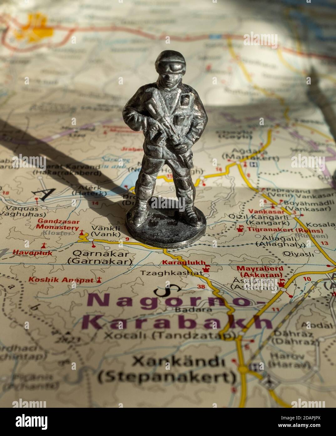 A figurine of an armed soldier on the map of Nagorno-Karabakh. Stock Photo