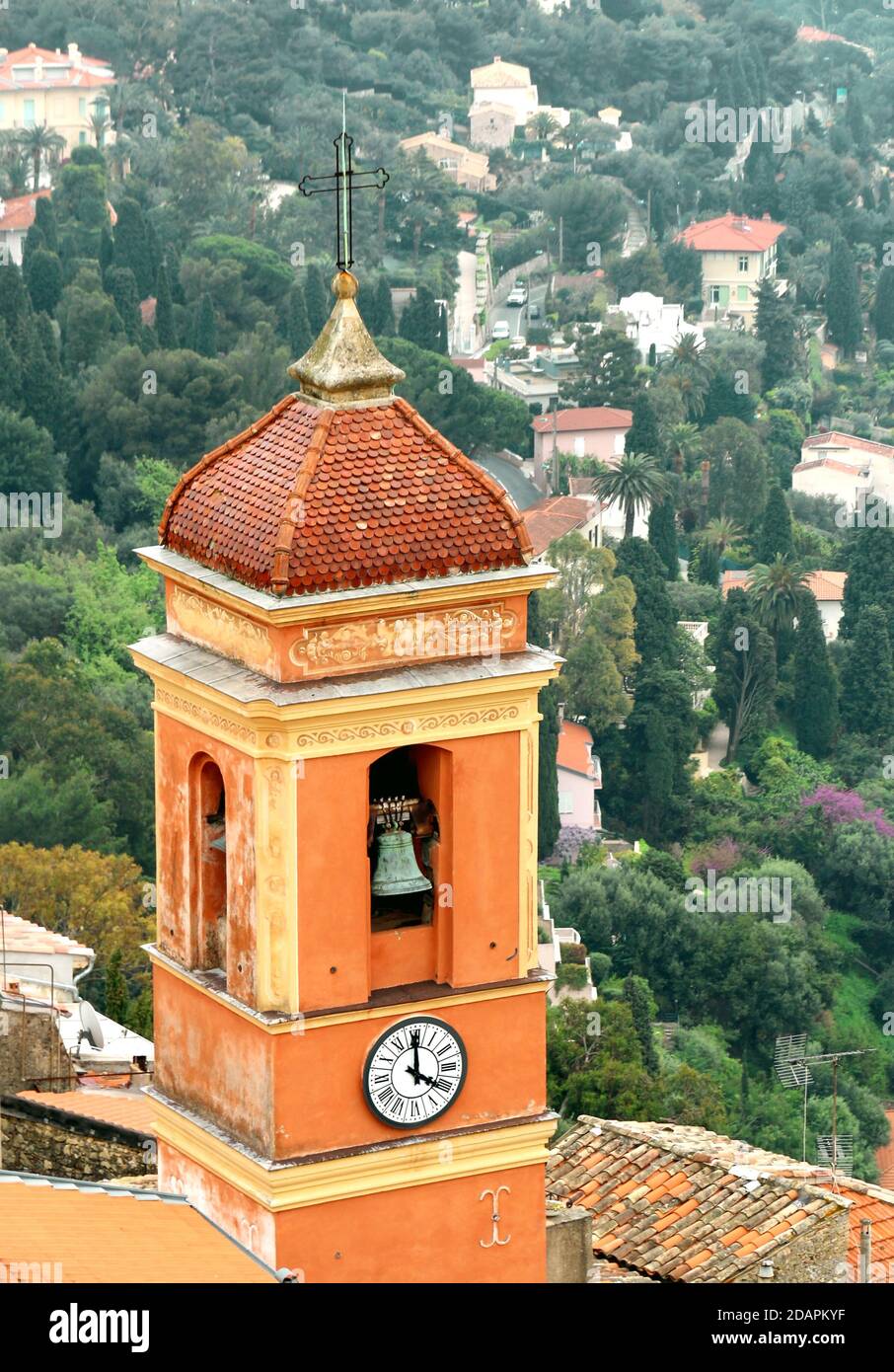 Ocher bell tower of the village of Roquebrune-Cap-Martin on the Côte d'Azur in France. Stock Photo