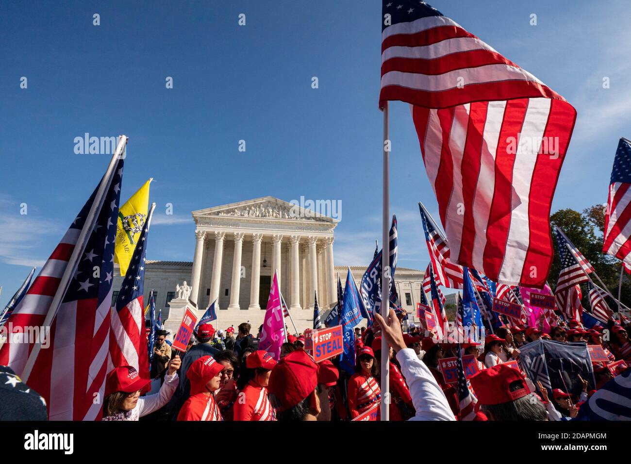 Washington, United States. 14th Nov, 2020. Pro President Trump supporters who are part of the 'Million MAGA March', make their way to the Supreme Court in Washington, DC on Saturday, November 14, 2020. Some of President Trump's staff are pushing to keep him in office in spite of an obvious win for President elect Joe Biden in both electoral and popular votes causing a national security crisis. Photo by Ken Cedeno/UPI Credit: UPI/Alamy Live News Stock Photo