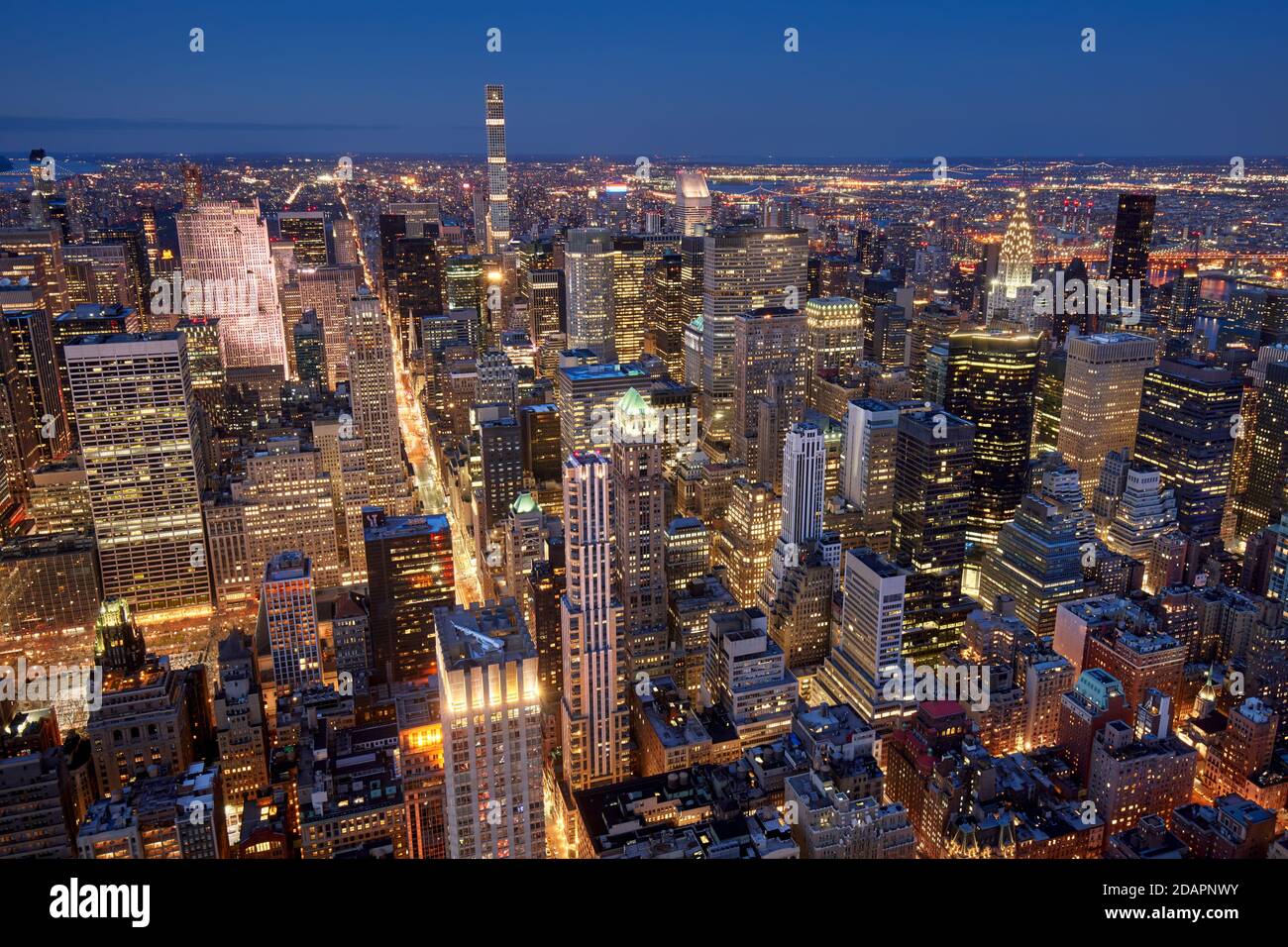 Aerial evening view of Midtown New York City skyline along Fifth Avenue. Illuminated Manhattan skyscrapers, NYC.USA Stock Photo