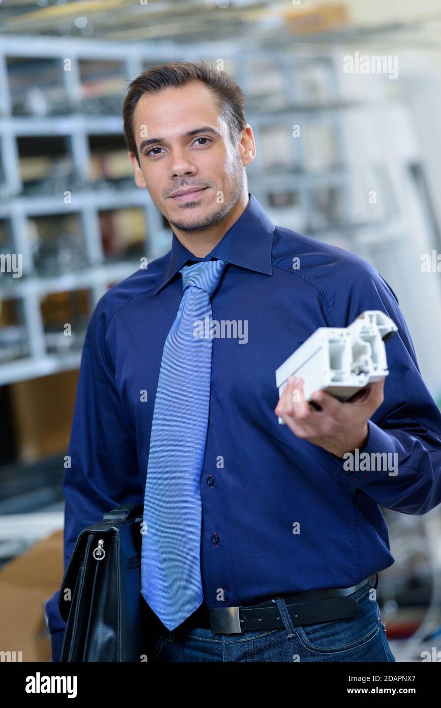 portrait of windows salesman holding sample Stock Photo Alamy