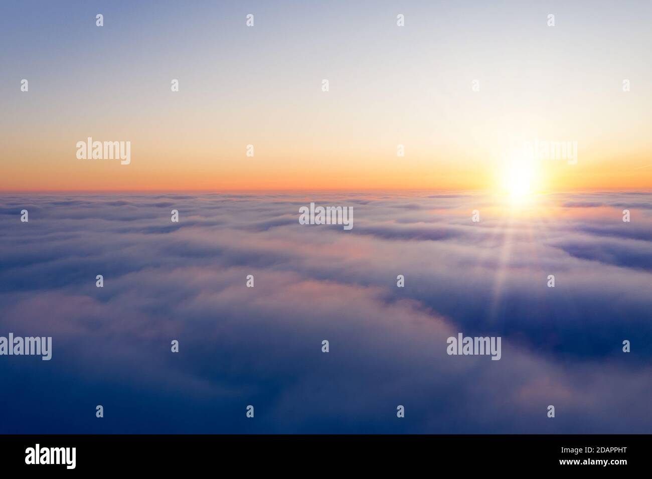 Arial view from plane on the sunrise sky, beautiful cloudy sky panoramic view Stock Photo